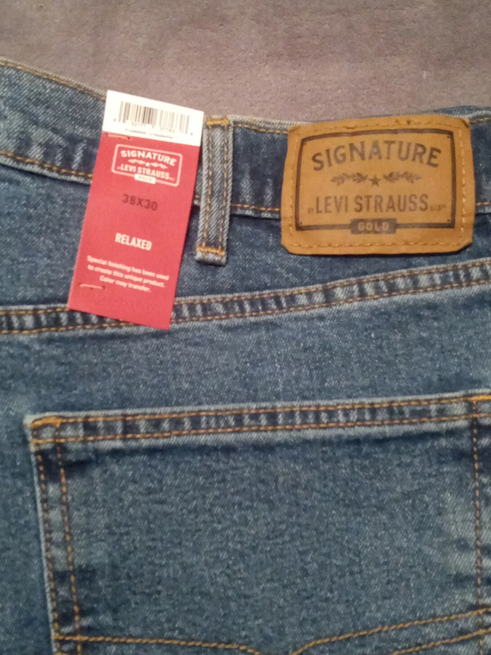 Levi's Signature Relaxed Fit Jeans in Blue with Brown Patch